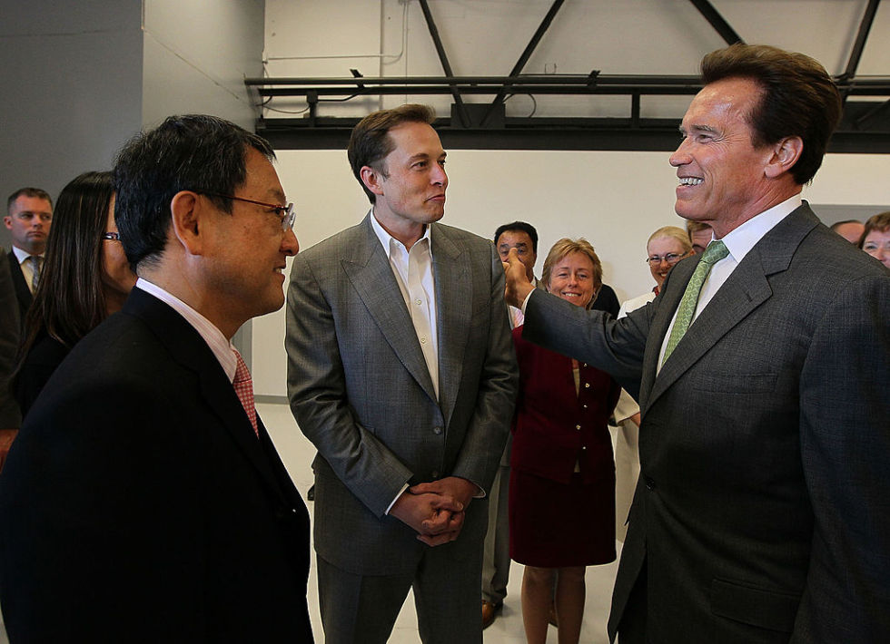PALO ALTO, CA - MAY 20: (L-R) Toyota CEO Akio Toyoda, Tesla Motors CEO Elon Musk and California governor Arnold Schwarzenegger chat before a news conference at Tesla Motors headquarters May 20, 2010 in Palo Alto, California. Electric car maker Tesla Motors annoucned a partnership with Japanese automaker Toyota to make electric cars in the United States. The cars will be manufactured at the recently shuttered NUMMI plant in Fremont, California where Toyota had pulled out after a joint partnership with General Motors had ended. (Photo by Justin Sullivan/Getty Images)