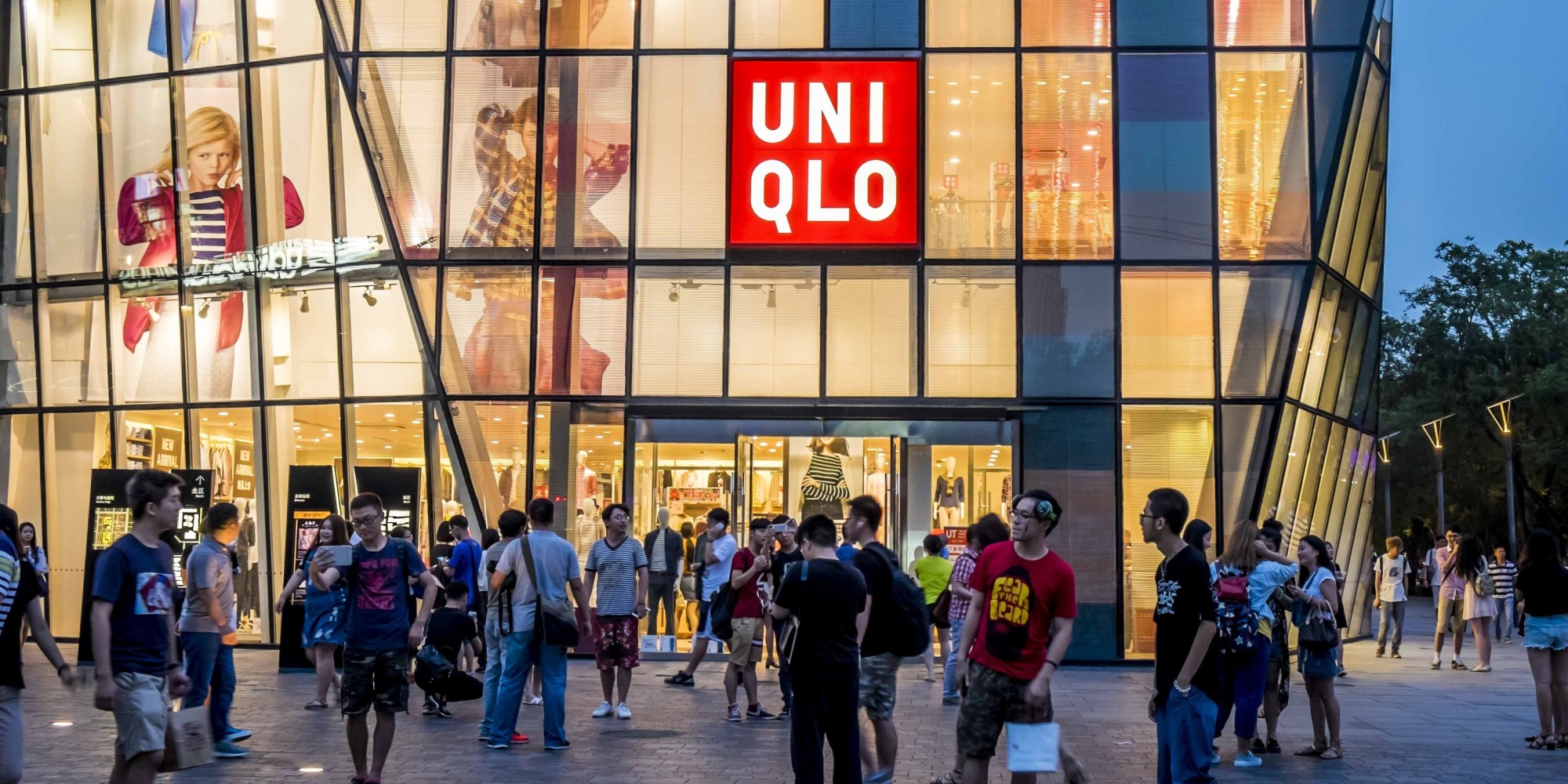 BEIJING, CHINA - JULY 15: (CHINA OUT) People walk by a Uniqlo outlet at Sanlitun after a sex video taken in what appears to be a Uniqlo store fitting room spread online on July 15, 2015 in Beijing, China. The video shot by a smartphone showed a young couple having sex in what appears to be a Uniqlo store fitting room. The Cyberspace Administration of China urged Sina and Tencent to increase their awareness of social responsibility, strengthen management and cooperate with the authority in investigating the case. (Photo by ChinaFotoPress/ChinaFotoPress via Getty Images)