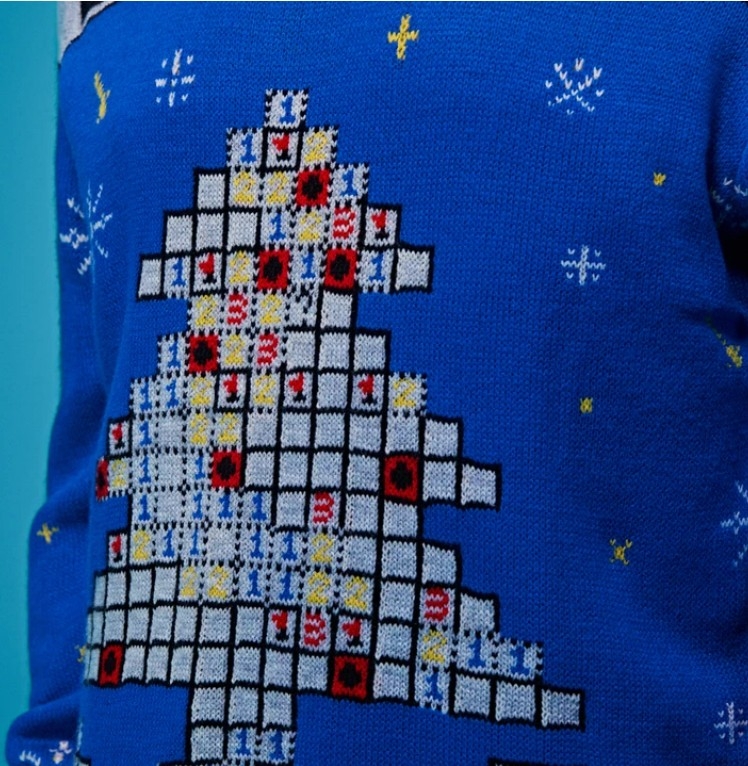 微軟今次推出的醜毛衣藏有不少細節,關卡上的炸彈和按鈕不僅化身為雪花,微笑黃臉小人更是戴上了聖誕帽。